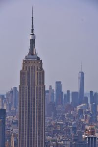 Modern buildings in city against sky