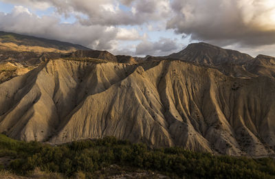 Panoramic view of landscape of tabernas desert in almeria, spain, against cloudy sky