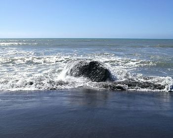 Scenic view of sea against clear sky