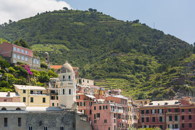 Buildings in town against sky