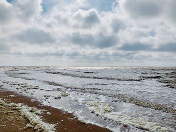 Scenic view of beach against sky