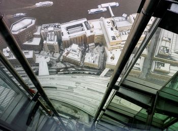 High angle view of buildings seen through glass