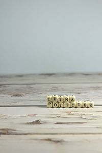 Close-up of objects on table against white background
