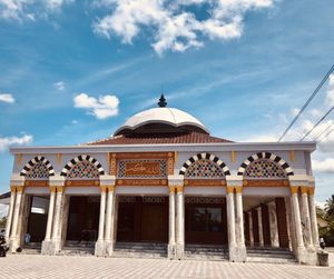 Facade of temple building against sky