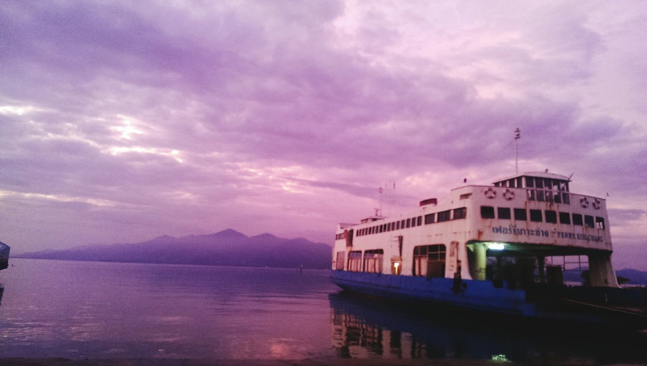 architecture, built structure, sky, water, building exterior, cloud - sky, waterfront, cloudy, cloud, nautical vessel, transportation, river, nature, sea, weather, overcast, outdoors, scenics, sunset, mode of transport