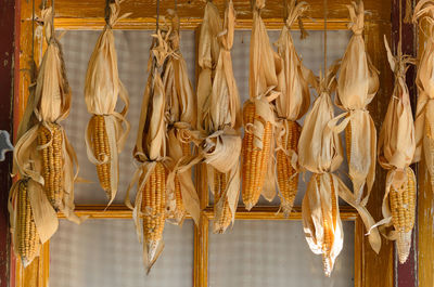 Corns hanging against closed window