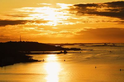 Scenic view of sea against orange sky