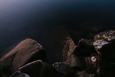 High angle view of rock formation in sea