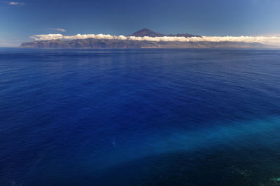 Seascape against mountain