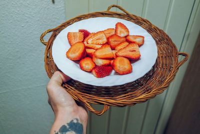 Directly above shot of person holding ice cream in basket