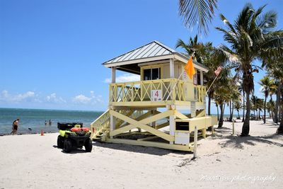 Built structure on beach against clear sky