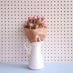 Close-up of flower vase on table