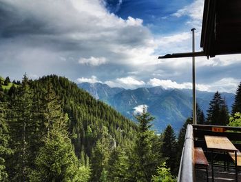 Scenic view of mountains against cloudy sky