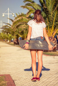 Rear view of woman walking in park