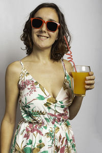 Portrait of young woman wearing sunglasses