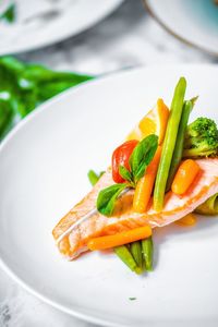 High angle view of vegetables in plate on table