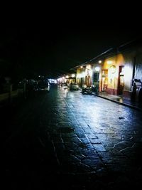 View of illuminated street at night