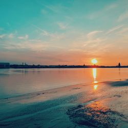 Scenic view of beach against sky during sunset