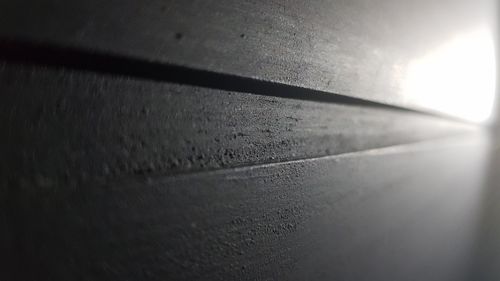 High angle view of sunlight falling on wall