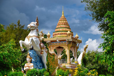 Statue of deity, god or goddess riding a horse at the wat chai chumphon chana songkhram temple