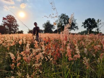 Full length of man standing on field against sky