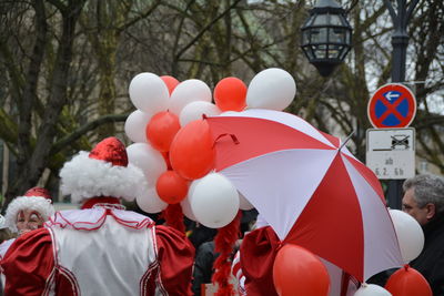 Clowns with balloons at park