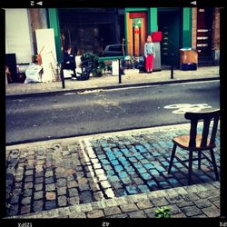 People on sidewalk in city
