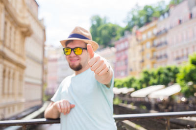 Portrait of young man standing outdoors