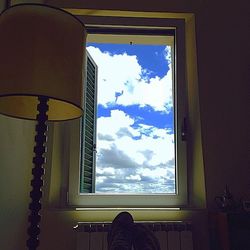 Cloudy sky seen through window