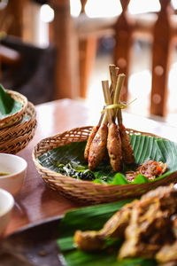 Close-up of basket in plate on table