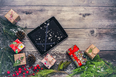 Christmas decoration and digital tablet on table