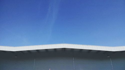 Low angle view of built structure against clear blue sky
