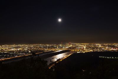 Aerial view of illuminated cityscape at night