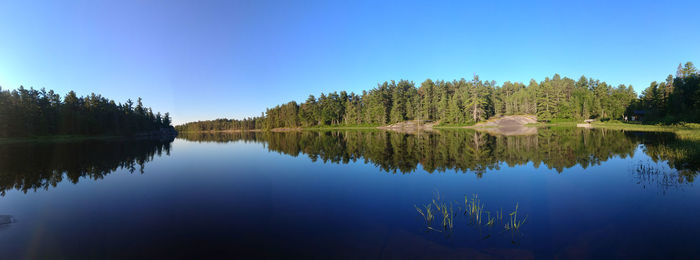 Scenic view of lake against blue sky