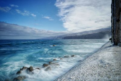 Scenic view of sea against sky during winter