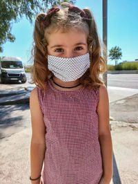 Portrait of girl standing in car