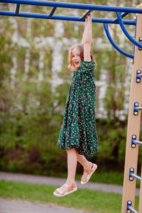 Full length of a girl playing in playground