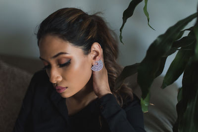 Portrait of young woman looking away