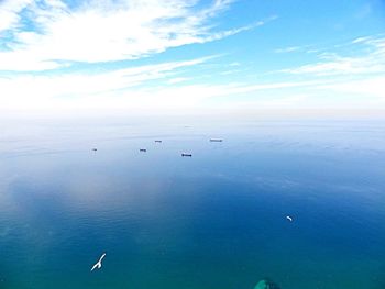 Scenic view of sea against cloudy sky