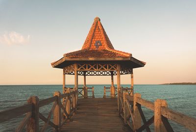 Pier over sea against sky