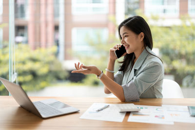 Businesswoman working at desk in office