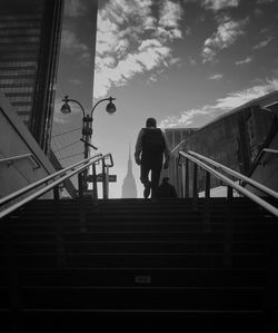 Low angle view of man walking on stairs