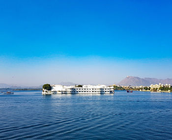 Scenic view of sea against clear blue sky