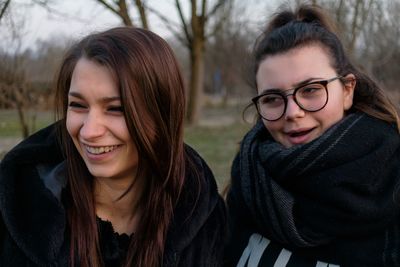 Friends in forest during winter