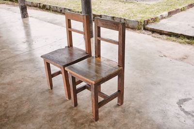 High angle view of empty chairs and table in park