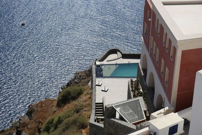 High angle view of buildings by sea