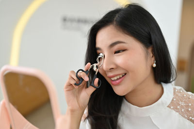 Close-up of young woman looking away