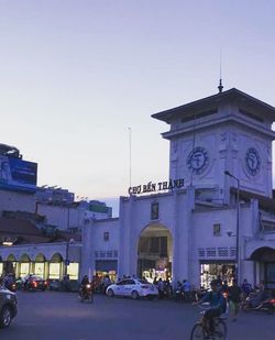 People in city against clear sky