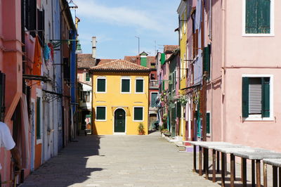 Narrow street amidst buildings in town