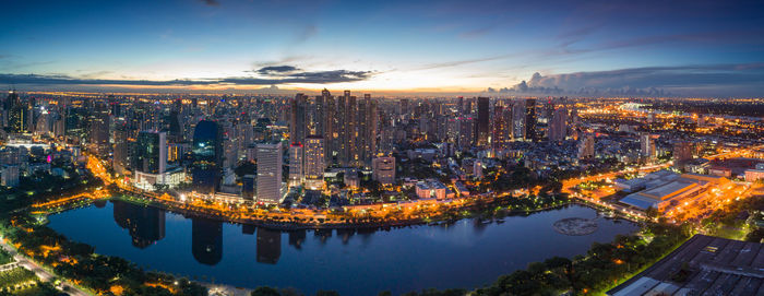 High angle view of illuminated buildings against sky at night